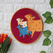 Crafted on a wooden plate, this pichwai portrays three cows in a circular formation.